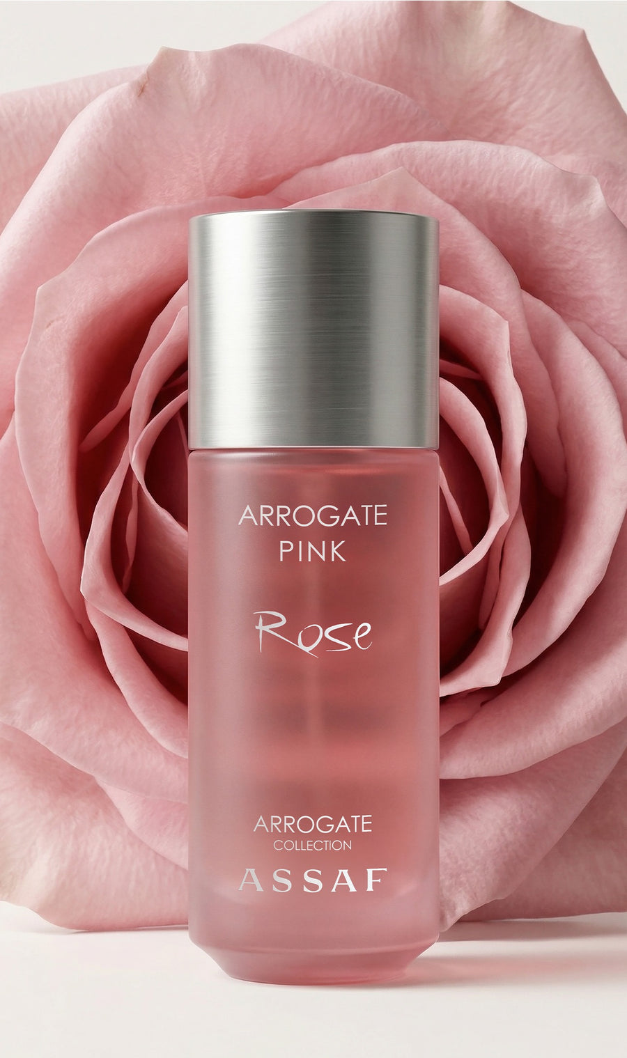 Assaf Arrogate Pink Rose bottle in front of a pink rose